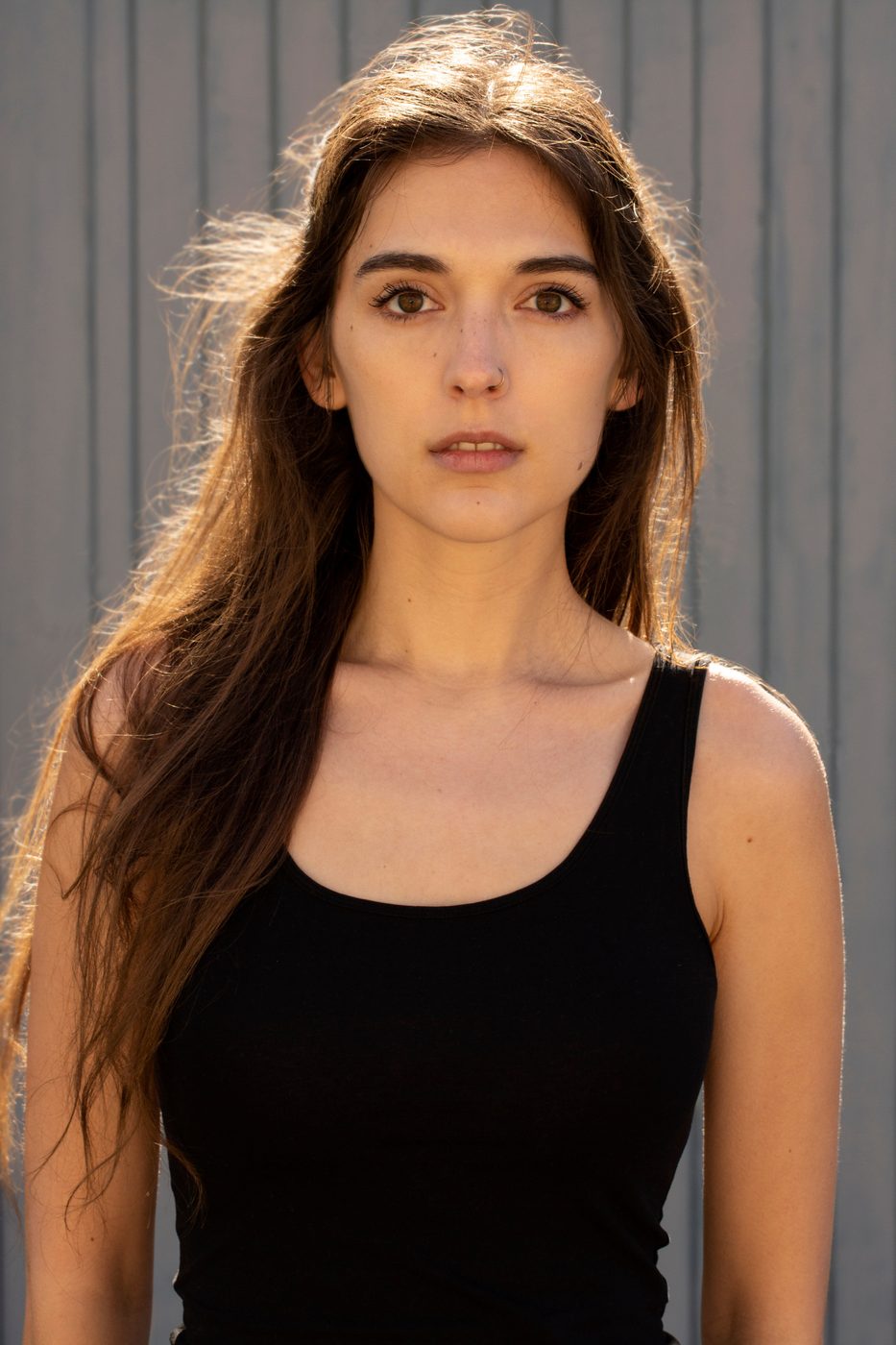 Clean studio portrait in a black tank